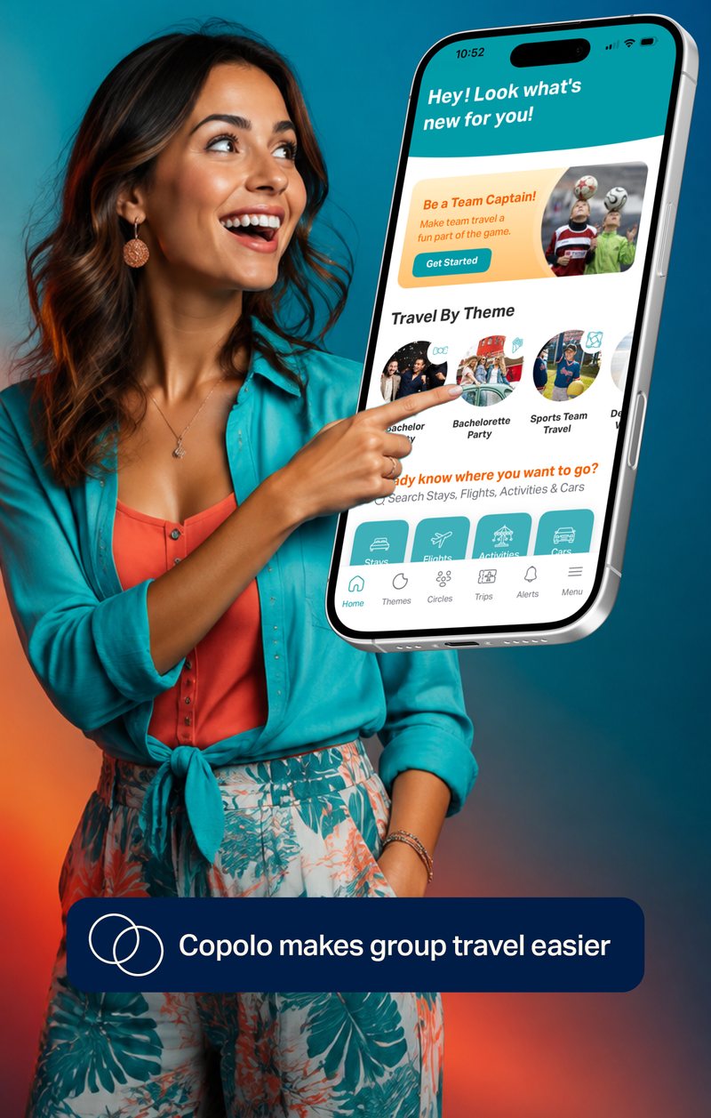 A woman pointing at the Copolo app home screen on her phone, smiling.